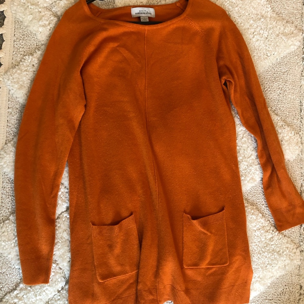 Soft orange sweater with pockets